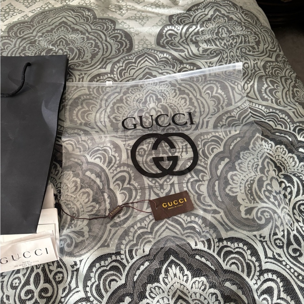 3 Gucci shopping bags. 2 paper and one plastic